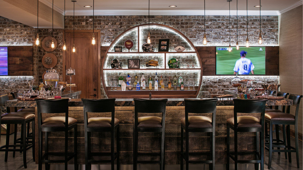 Photo of a large urban single-wall breakfast bar in Omaha with open cabinets, brick splashback, concrete flooring, grey floors, medium wood cabinets and granite worktops.