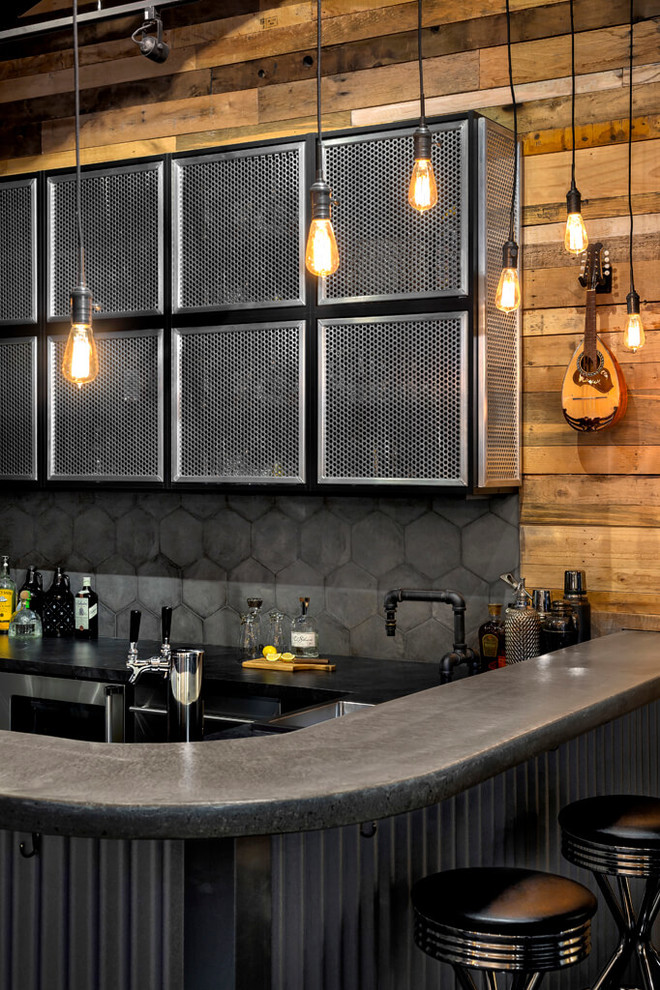 Inspiration for a medium sized industrial l-shaped home bar in Vancouver with a submerged sink, concrete worktops, grey splashback, porcelain splashback, carpet and grey floors.