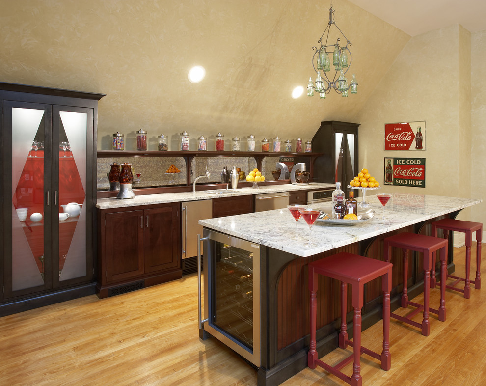 Example of a large eclectic galley medium tone wood floor seated home bar design in Chicago with an undermount sink, shaker cabinets, dark wood cabinets, marble countertops and mirror backsplash