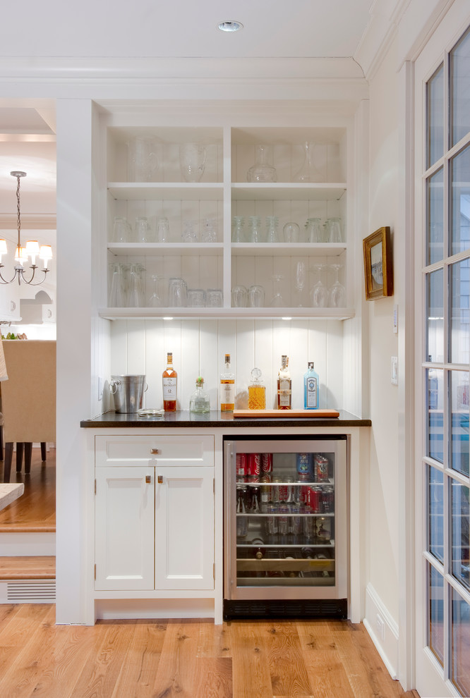 Inspiration for a coastal home bar remodel in New York