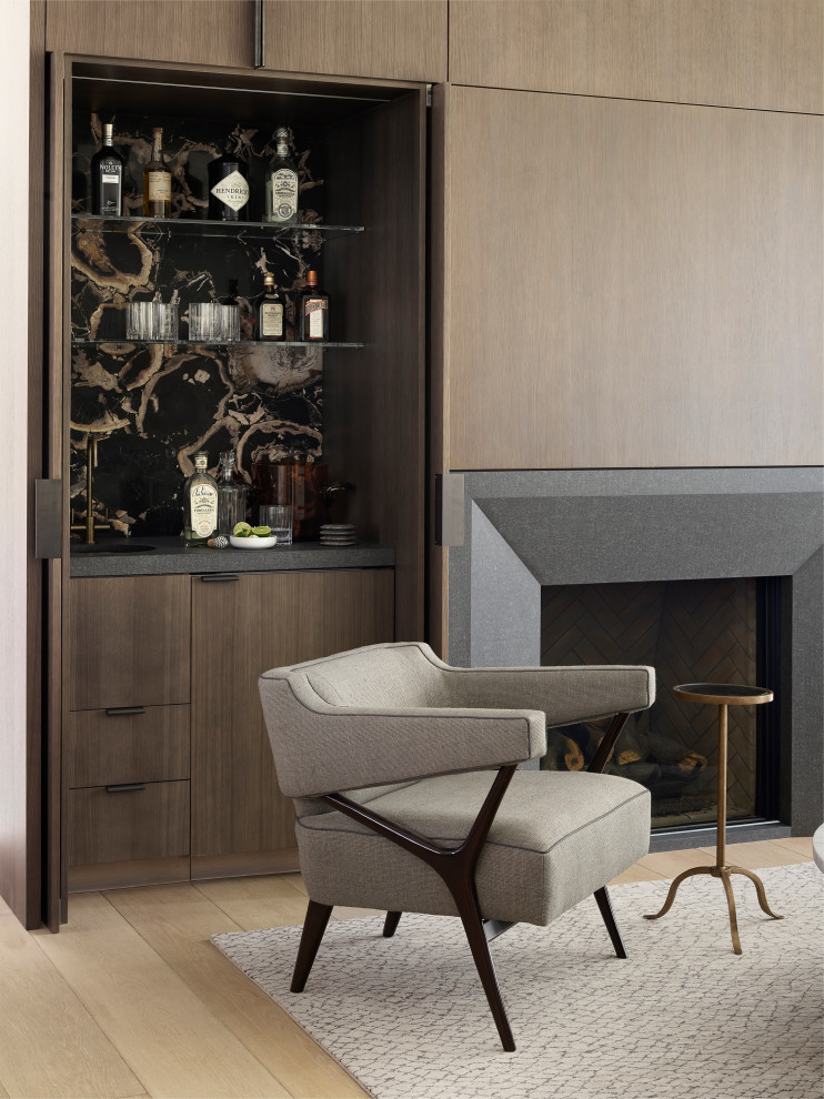 Design ideas for a small modern single-wall wet bar in San Francisco with light hardwood flooring, beige floors, a submerged sink, flat-panel cabinets, medium wood cabinets, engineered stone countertops, black splashback and grey worktops.