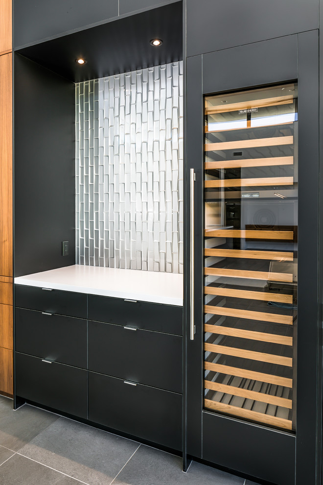 Small contemporary single-wall home bar in Phoenix with flat-panel cabinets, black cabinets, engineered stone countertops, metal splashback, porcelain flooring, grey floors and white worktops.