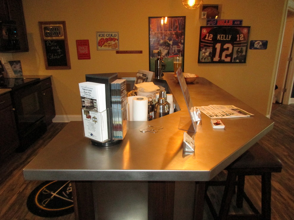Photo of a medium sized modern u-shaped breakfast bar in New Orleans with no sink, dark wood cabinets, stainless steel worktops, white splashback and vinyl flooring.