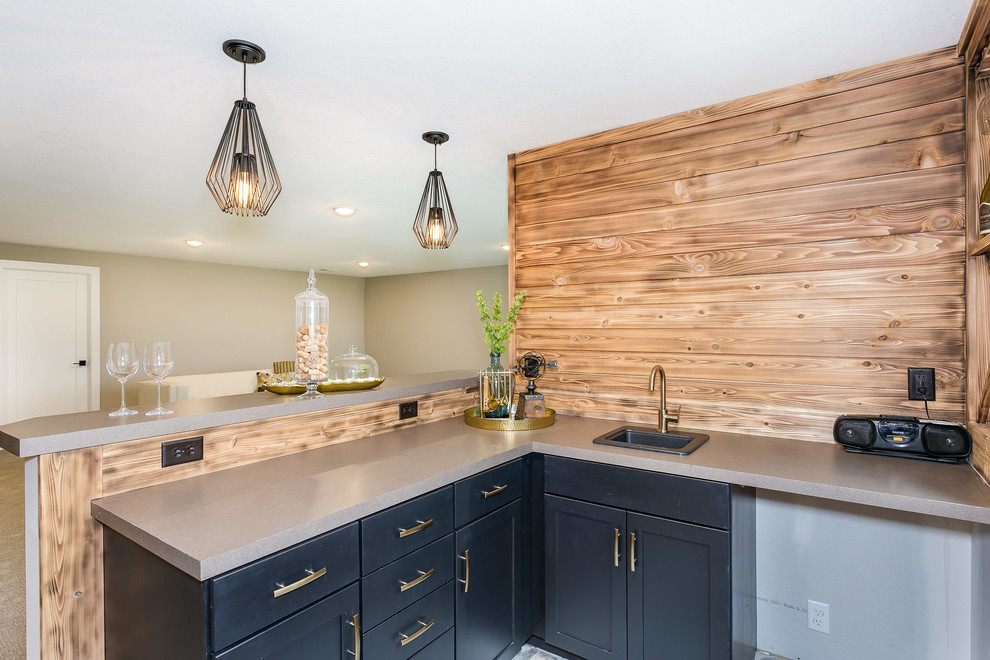 Inspiration for a small contemporary l-shaped seated home bar remodel in Wichita with a drop-in sink, shaker cabinets, black cabinets and wood backsplash