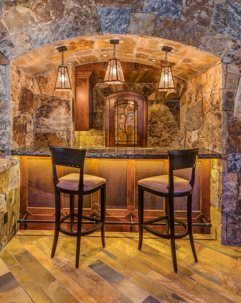 Mid-sized mountain style single-wall plywood floor seated home bar photo in Denver with recessed-panel cabinets and dark wood cabinets