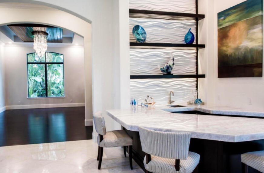This is an example of a medium sized modern galley breakfast bar in Miami with a submerged sink, dark wood cabinets, marble worktops, limestone flooring and white worktops.