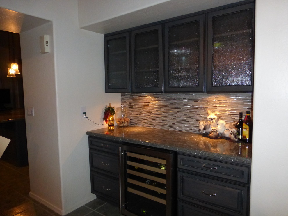 This is an example of a contemporary home bar in Phoenix.