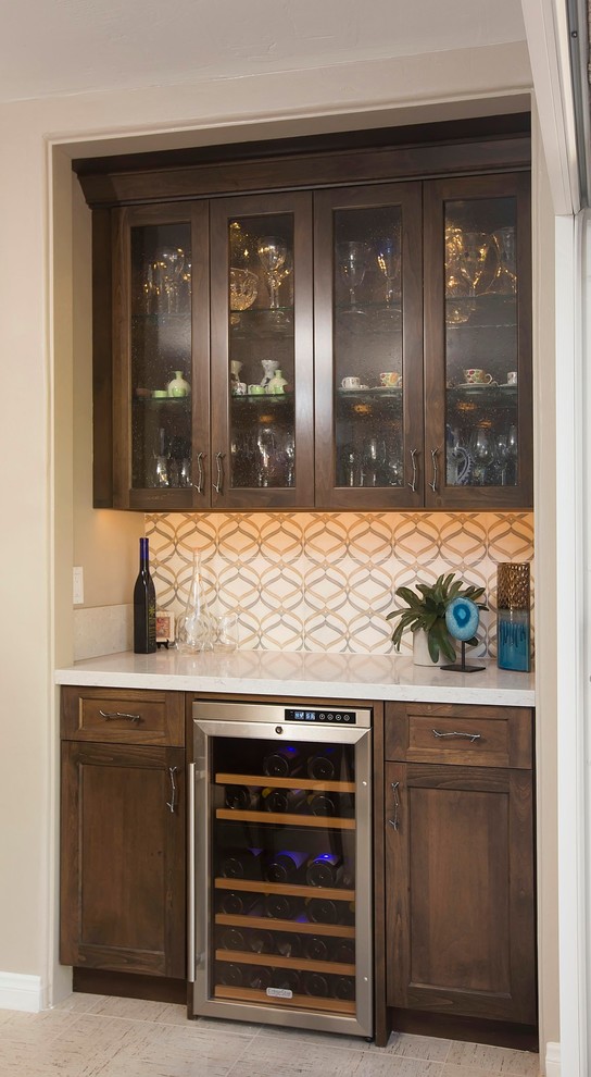 Inspiration for a small contemporary single-wall wet bar in San Diego with no sink, shaker cabinets, dark wood cabinets, engineered stone countertops, multi-coloured splashback, stone tiled splashback and ceramic flooring.