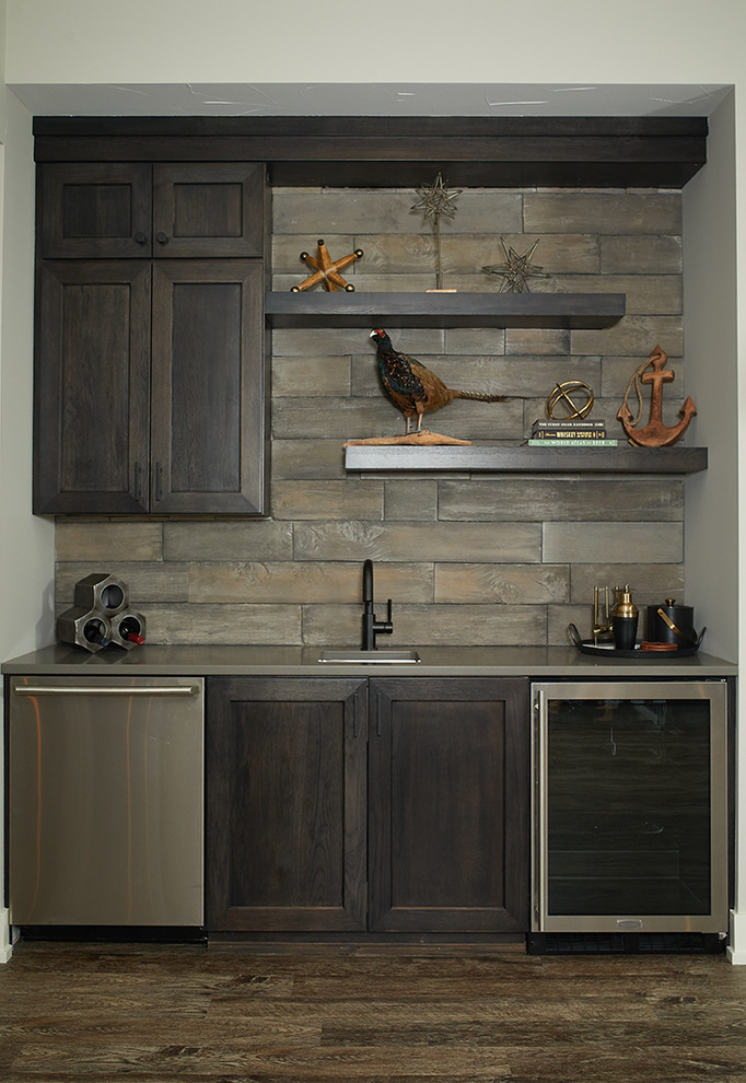 Inspiration for a transitional single-wall dark wood floor and brown floor wet bar remodel in Grand Rapids with an undermount sink, shaker cabinets, dark wood cabinets and brown backsplash