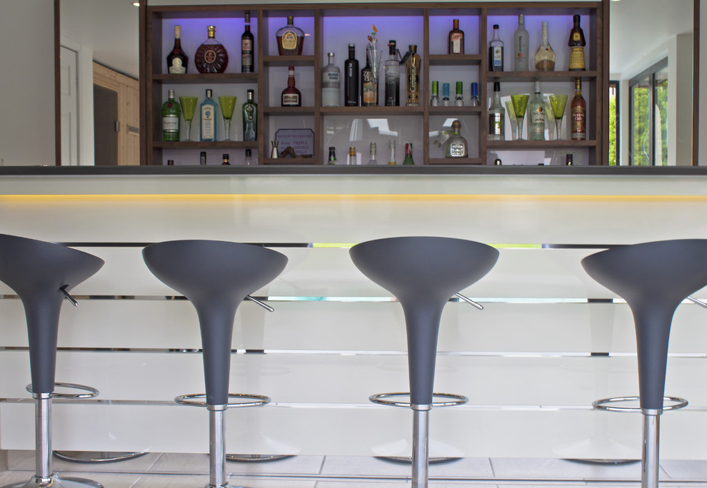 This is an example of a medium sized coastal home bar in Dorset.