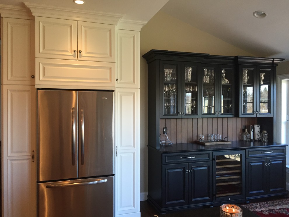 Wet bar - mid-sized traditional single-wall dark wood floor and brown floor wet bar idea in Philadelphia with raised-panel cabinets, black cabinets, solid surface countertops, brown backsplash and wood backsplash