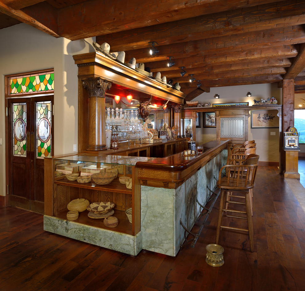 Inspiration for a rustic home bar remodel in Austin