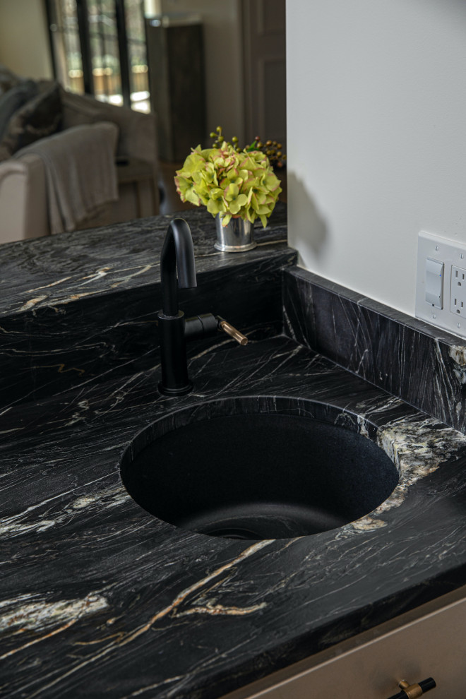 This is an example of a contemporary home bar in Other with a submerged sink, quartz worktops and black worktops.