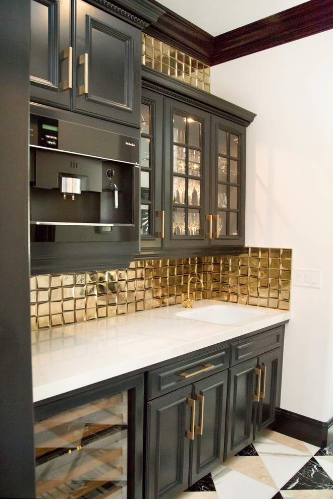 Mid-sized trendy single-wall marble floor and multicolored floor wet bar photo with an undermount sink, recessed-panel cabinets, gray cabinets, marble countertops, yellow backsplash, metal backsplash and white countertops