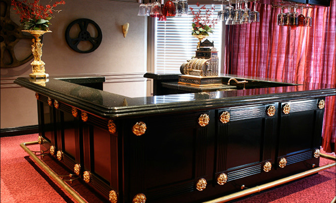 Example of an arts and crafts home bar design in San Diego