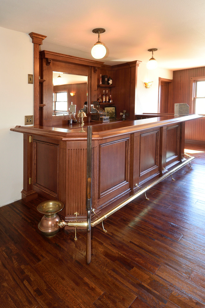 Medium sized victorian home bar in Other with red cabinets, wood worktops, wood splashback, dark hardwood flooring, yellow floors and red worktops.