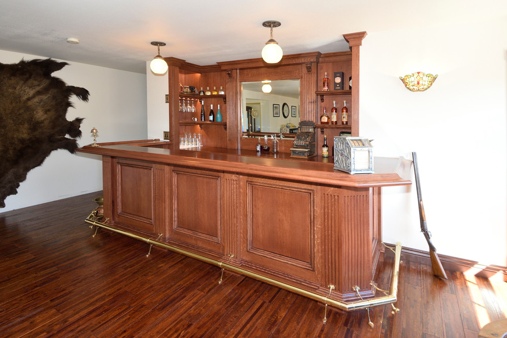 Photo of a medium sized victorian home bar in Other with red cabinets, wood worktops, wood splashback, dark hardwood flooring, yellow floors and red worktops.