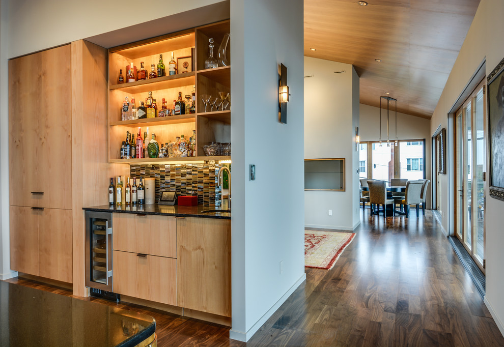 Small minimalist single-wall dark wood floor wet bar photo in Seattle with an undermount sink, flat-panel cabinets, light wood cabinets, multicolored backsplash and ceramic backsplash