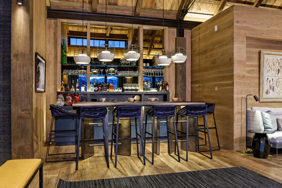 Design ideas for a rustic home bar in Denver.