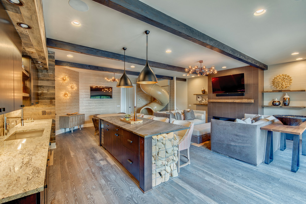 This is an example of a large contemporary breakfast bar in Charlotte with a submerged sink, flat-panel cabinets, dark wood cabinets, granite worktops and light hardwood flooring.