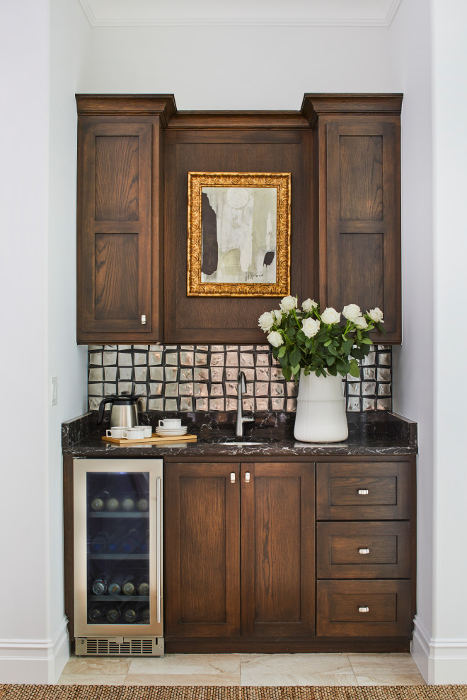 Medium sized traditional single-wall wet bar in Other with a submerged sink, shaker cabinets, dark wood cabinets, granite worktops, porcelain splashback, porcelain flooring, beige floors and black worktops.