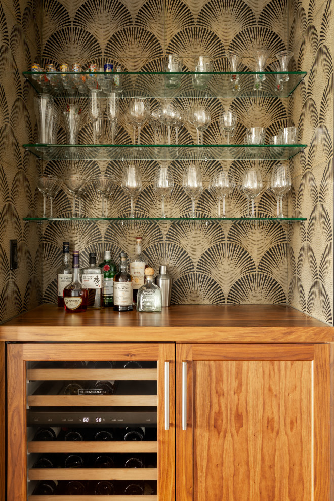 Home bar - contemporary single-wall home bar idea in New York with shaker cabinets, medium tone wood cabinets and brown countertops