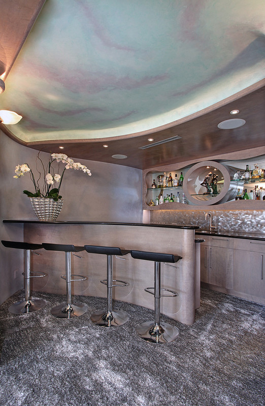 Inspiration for a large contemporary home bar remodel in Orange County