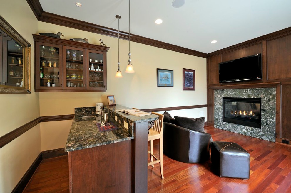 This is an example of a classic home bar in Other.