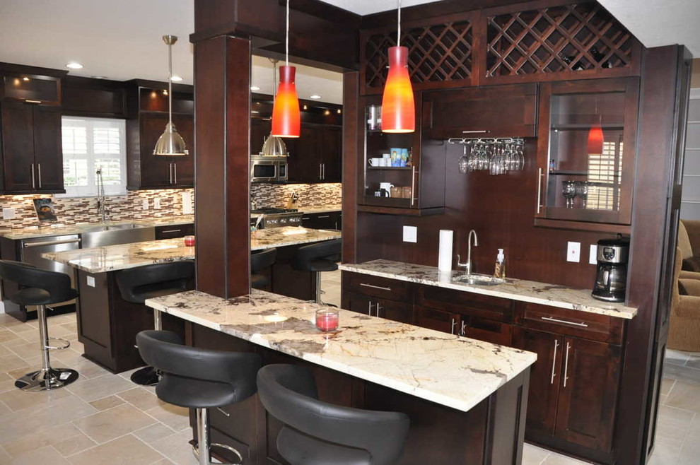 This is an example of a medium sized traditional single-wall breakfast bar in Tampa with a submerged sink, shaker cabinets, dark wood cabinets, granite worktops, travertine flooring, brown splashback and wood splashback.