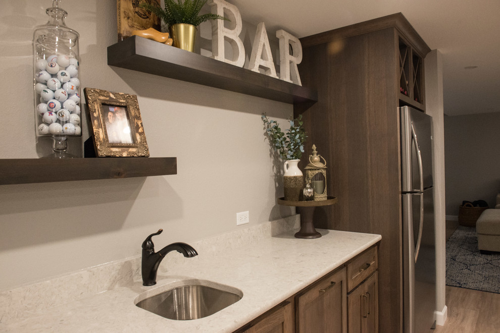 Wet bar - mid-sized rustic single-wall light wood floor and brown floor wet bar idea in Other with an undermount sink, shaker cabinets, medium tone wood cabinets, quartz countertops, white backsplash and white countertops