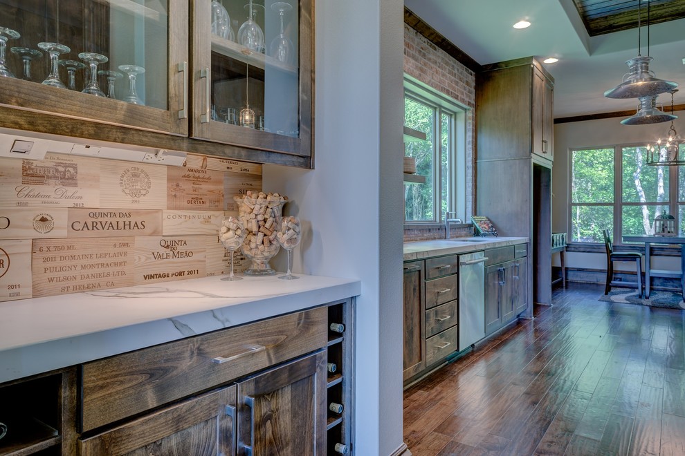 Photo of a medium sized rustic single-wall home bar in Indianapolis with shaker cabinets, medium wood cabinets, marble worktops, wood splashback and medium hardwood flooring.