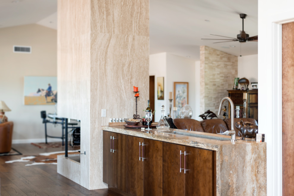 Mid-sized minimalist single-wall medium tone wood floor wet bar photo in Phoenix with an undermount sink, flat-panel cabinets, medium tone wood cabinets and limestone countertops