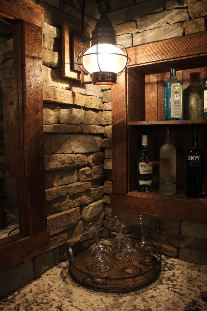 Seated home bar - mid-sized rustic single-wall porcelain tile and brown floor seated home bar idea in Boston with an undermount sink, brown backsplash, stone tile backsplash, granite countertops and beige countertops