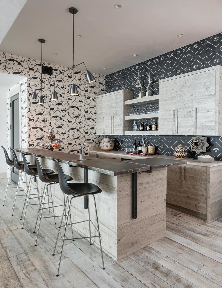 Inspiration for a rustic breakfast bar in Other with flat-panel cabinets, light wood cabinets, multi-coloured splashback, light hardwood flooring and beige floors.