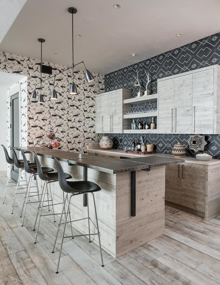 Seated home bar - rustic light wood floor and beige floor seated home bar idea in Other with flat-panel cabinets, light wood cabinets and multicolored backsplash