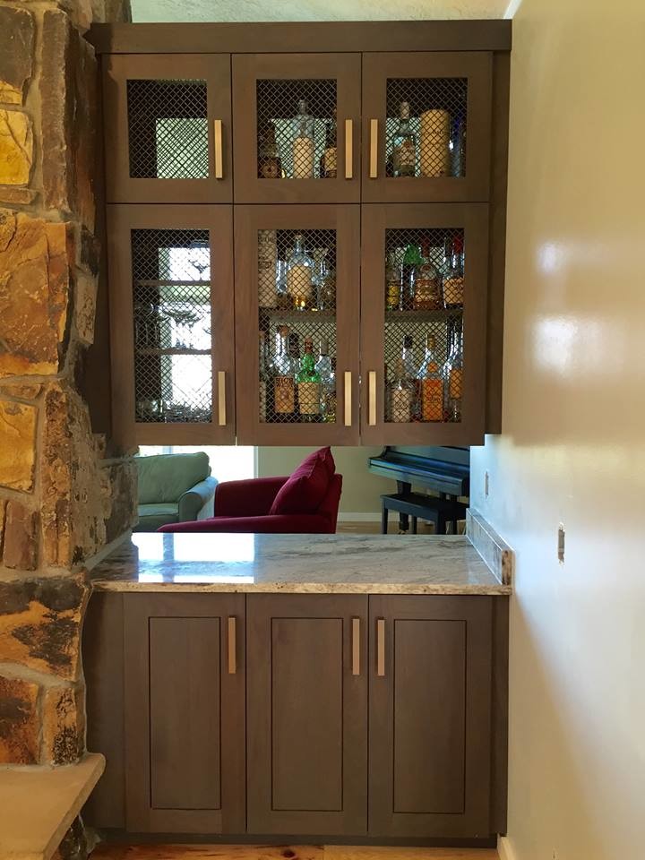 Inspiration for a small traditional single-wall wet bar in Salt Lake City with shaker cabinets, dark wood cabinets, marble worktops, light hardwood flooring, beige floors and grey worktops.