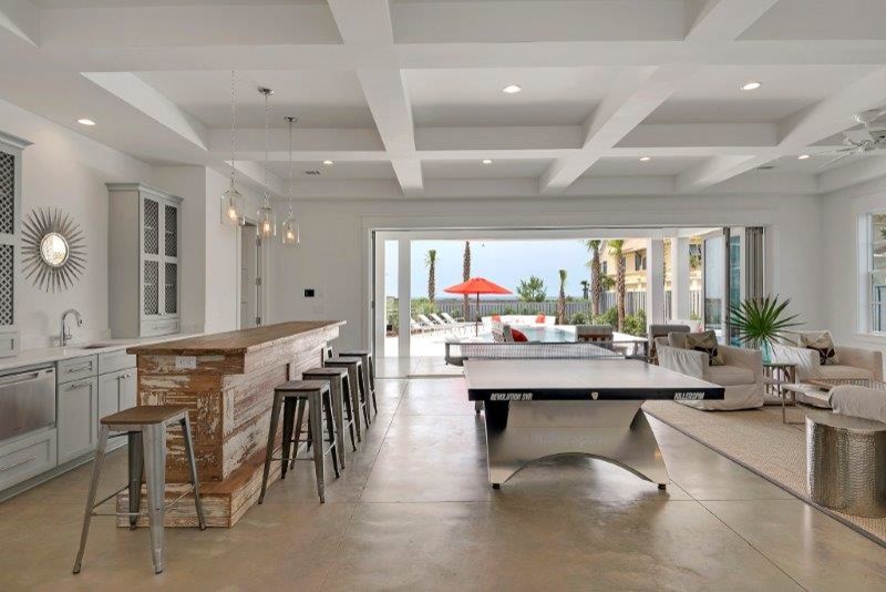 Inspiration for a large coastal single-wall concrete floor and brown floor seated home bar remodel in Miami with an undermount sink, shaker cabinets and gray cabinets