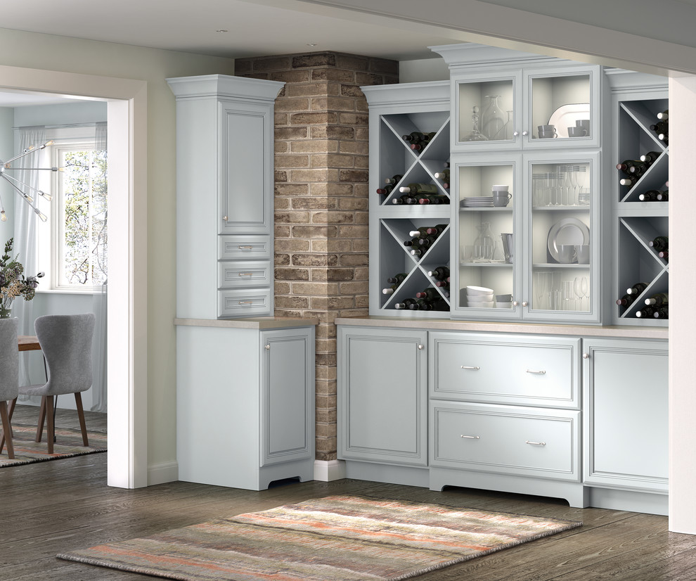 Traditional home bar in Other with blue cabinets.