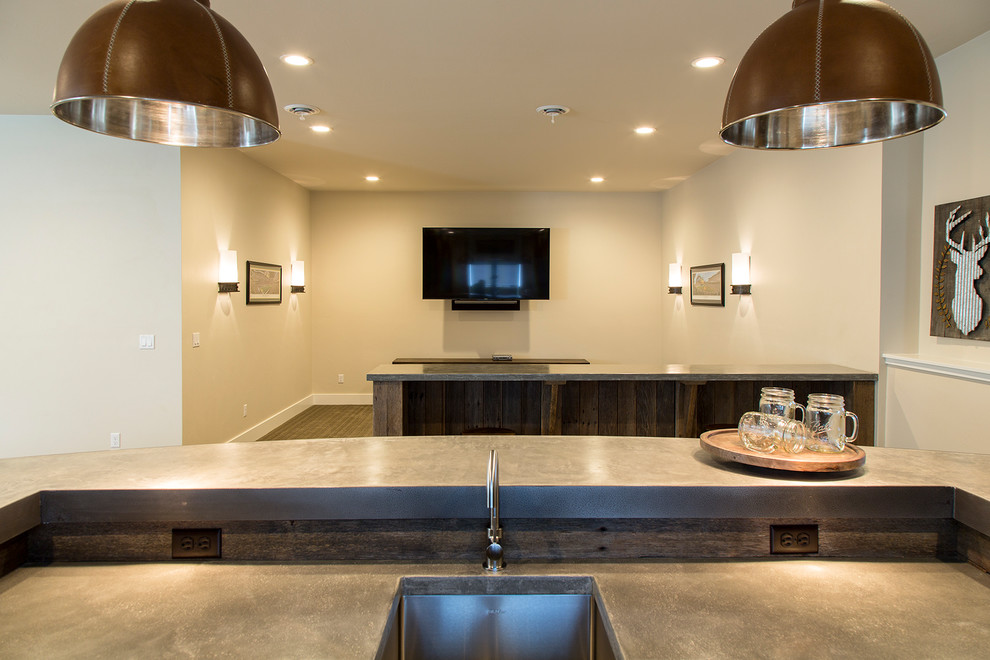 Example of a large arts and crafts single-wall brown floor seated home bar design in Other with an undermount sink, shaker cabinets, dark wood cabinets, concrete countertops and gray countertops