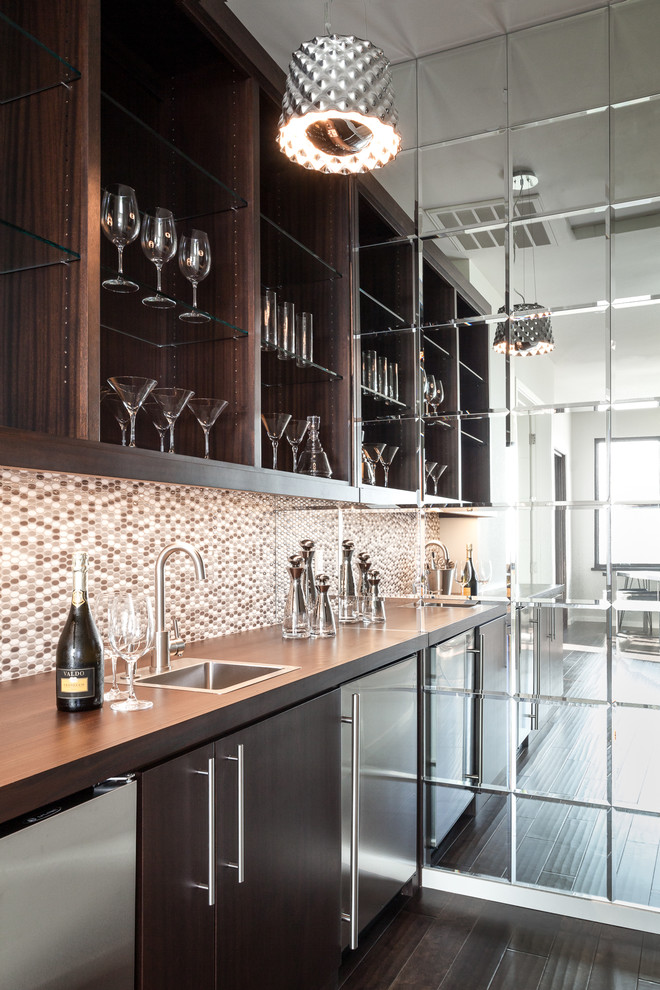 Inspiration for a transitional single-wall dark wood floor wet bar remodel in Sacramento with a drop-in sink, flat-panel cabinets, dark wood cabinets, wood countertops, brown backsplash and mosaic tile backsplash