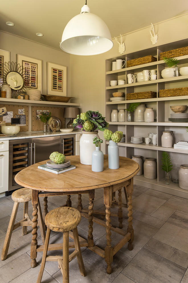 Medium sized farmhouse home bar in Birmingham with beige floors.