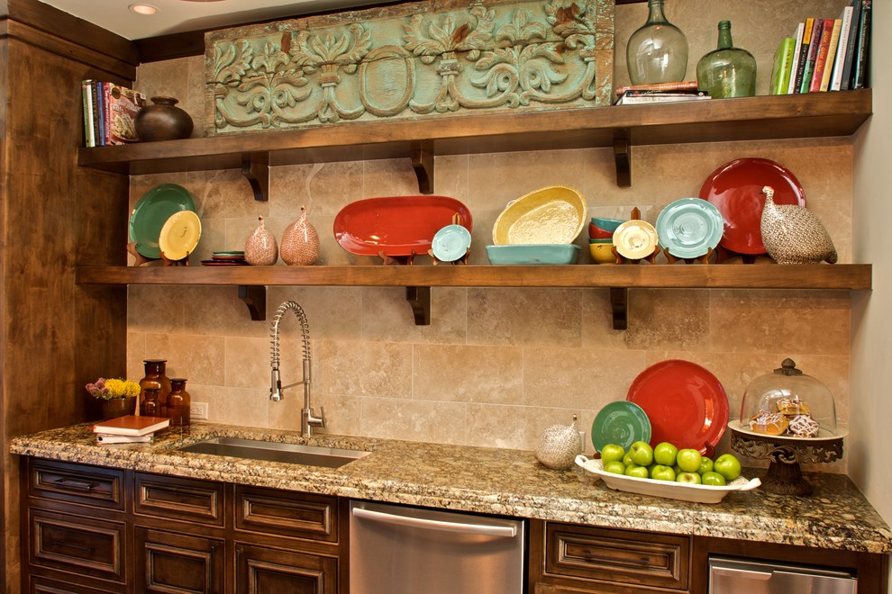 Example of a mid-sized tuscan single-wall wet bar design in Dallas with an undermount sink, recessed-panel cabinets, dark wood cabinets, granite countertops, beige backsplash and ceramic backsplash