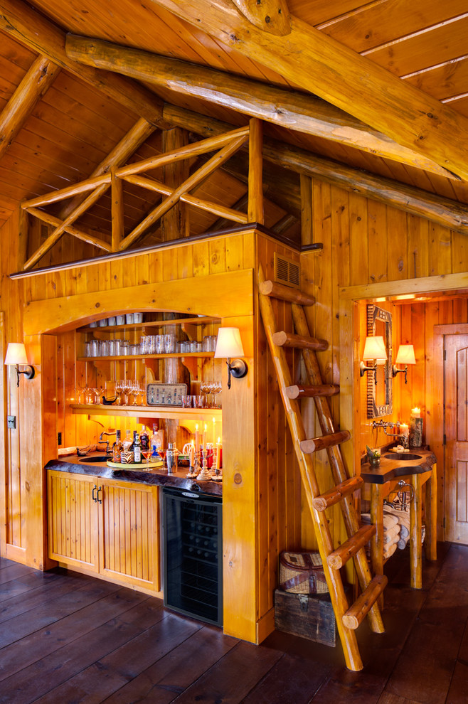 Example of a mountain style home bar design in Milwaukee