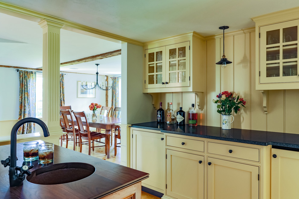 Inspiration for a small cottage home bar remodel in Boston