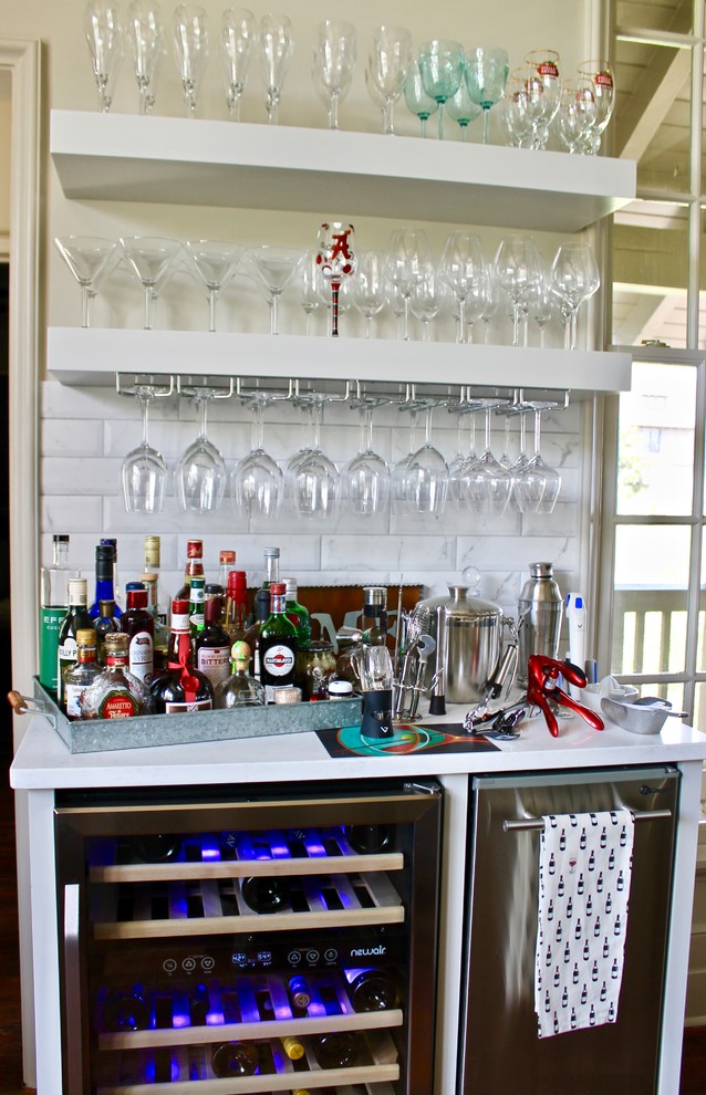 Example of a small transitional single-wall dark wood floor and brown floor wet bar design in Miami with white cabinets, white backsplash, brick backsplash and white countertops