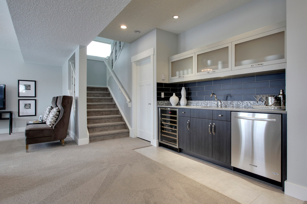 This is an example of a medium sized traditional single-wall wet bar in Calgary with flat-panel cabinets, dark wood cabinets and carpet.