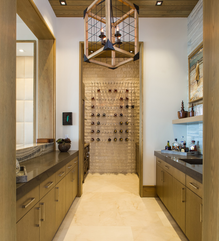 Idée de décoration pour un bar de salon avec évier parallèle tradition en bois brun avec un placard à porte plane.