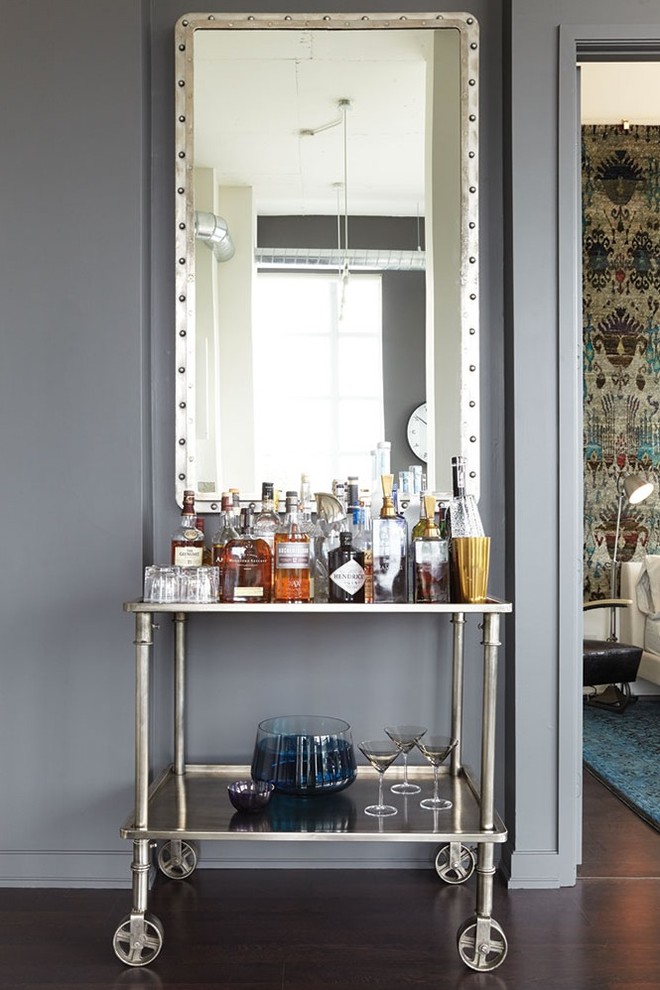 Home bar - industrial dark wood floor home bar idea in Toronto
