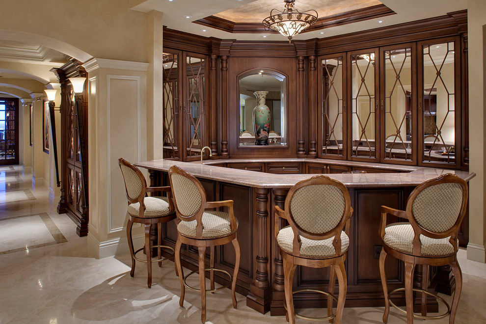 Example of a mid-sized classic u-shaped seated home bar design in Miami with glass-front cabinets and dark wood cabinets
