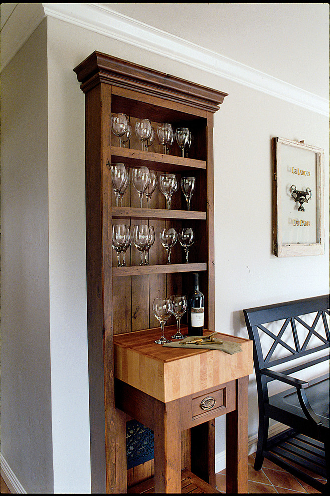 Photo of a small classic single-wall home bar in San Diego with flat-panel cabinets, wood worktops, terracotta flooring, medium wood cabinets, brown splashback and brown worktops.